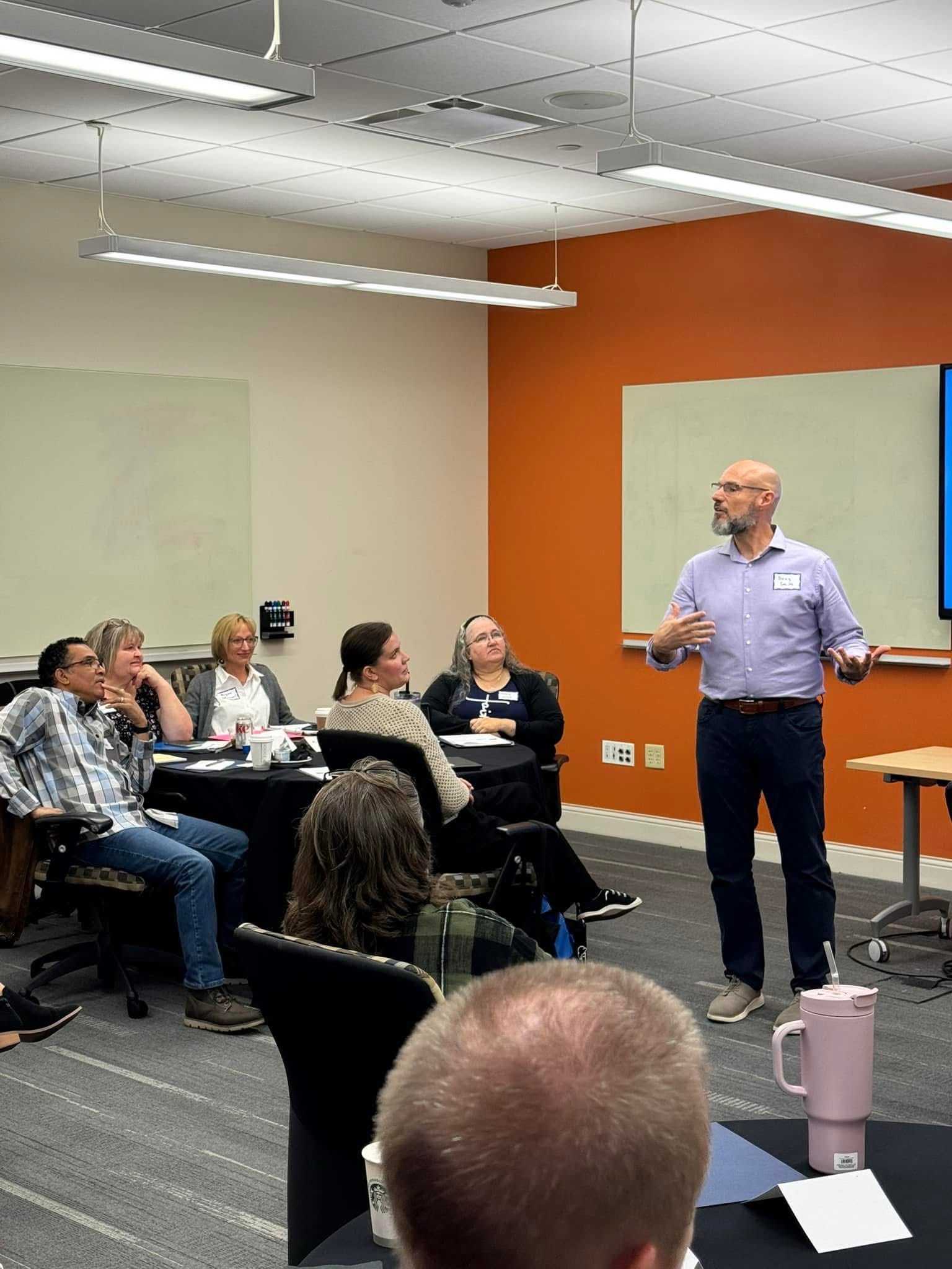 Doug Smith leading a session with an engaged group